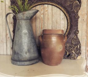 old metal jug with small copper container